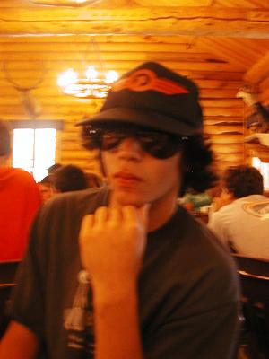 [Kyle wearing big glasses and a trucker hat]